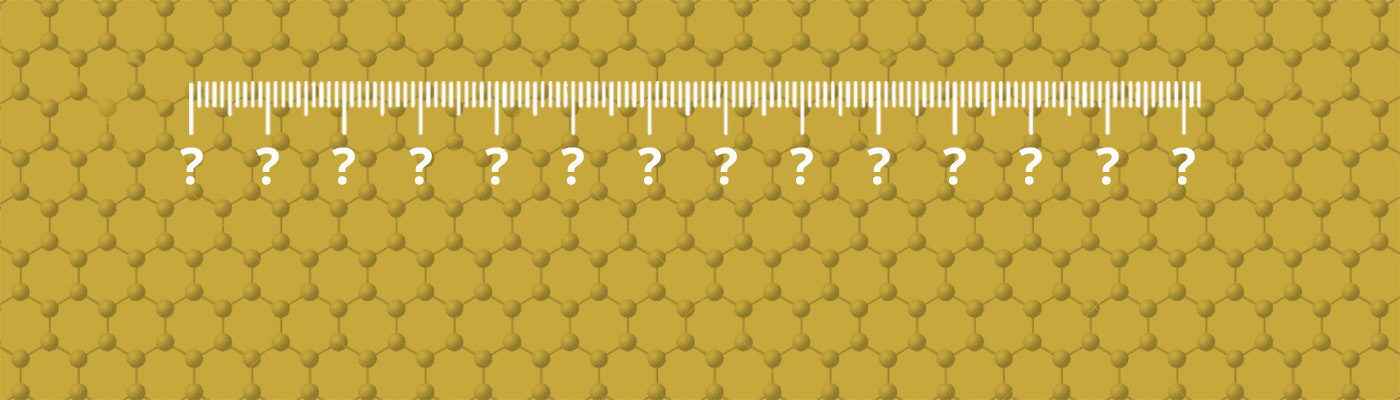 Ruler with question marks on a gold-coloured graphene sheet