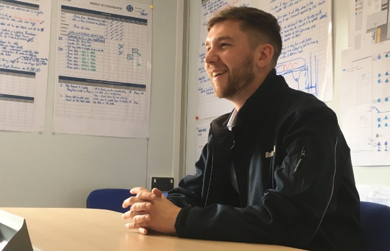 Evan Smith smiling in Balfour Beatty offices on MECD site