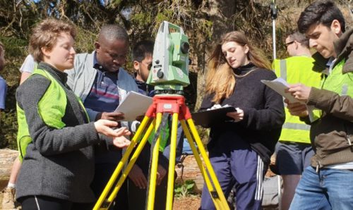 Civil engineering students taking measurements on a field trip to Patterdale, Cumbria