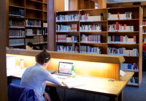 student working in the library