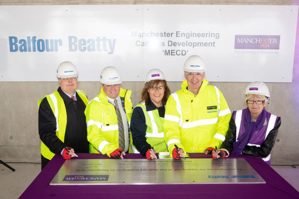 Signing girder at MECD topping out