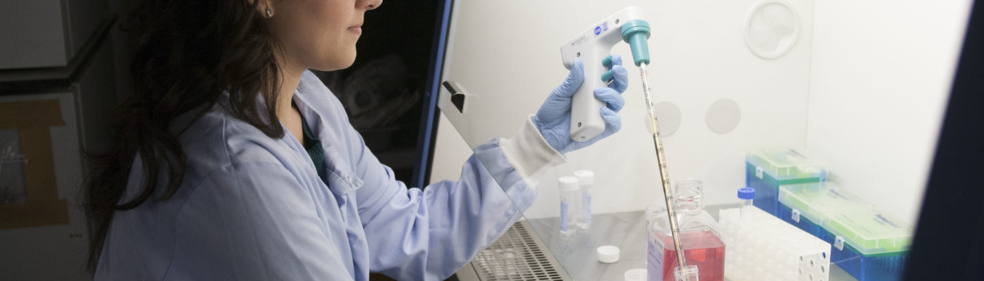 Woman scientist looking at samples