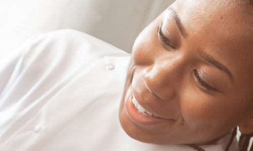 A Black woman scientist in lab coat