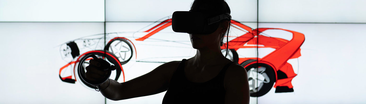 Woman using virtual reality to design a car