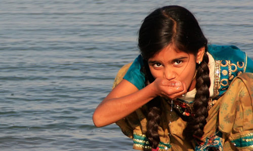 Girl drinking water in India