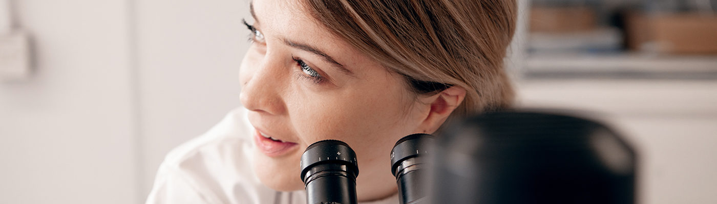 Woman scientist with microscope