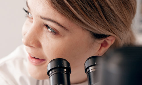 Woman scientist with microscope