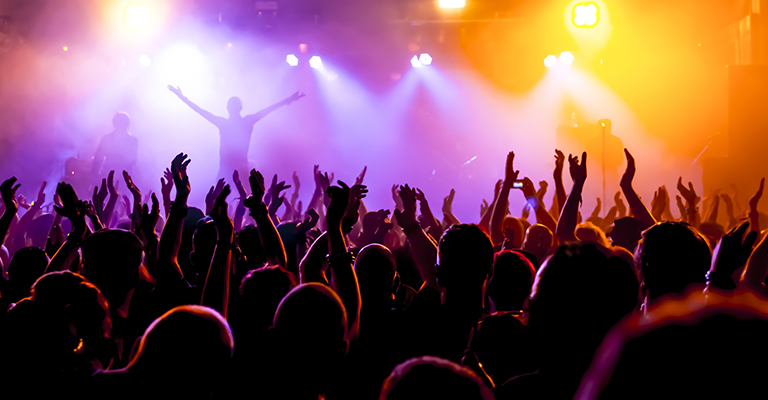 Singer in front of a cheering crowd