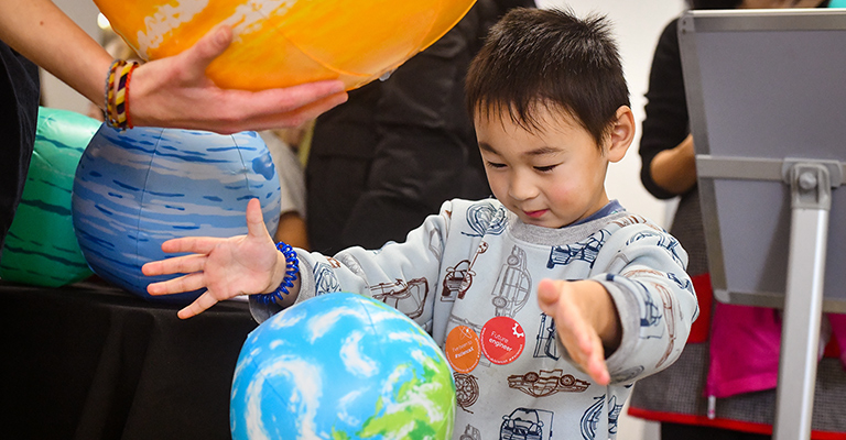 Child with a blow-up globe