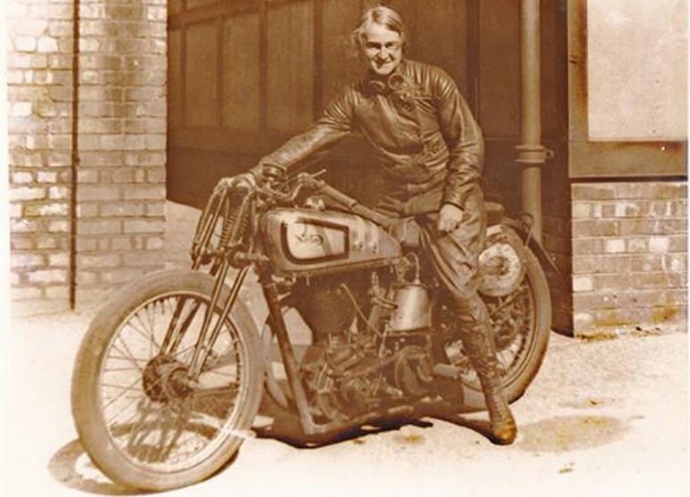 Beatrice Shilling sits on her motorcycle.