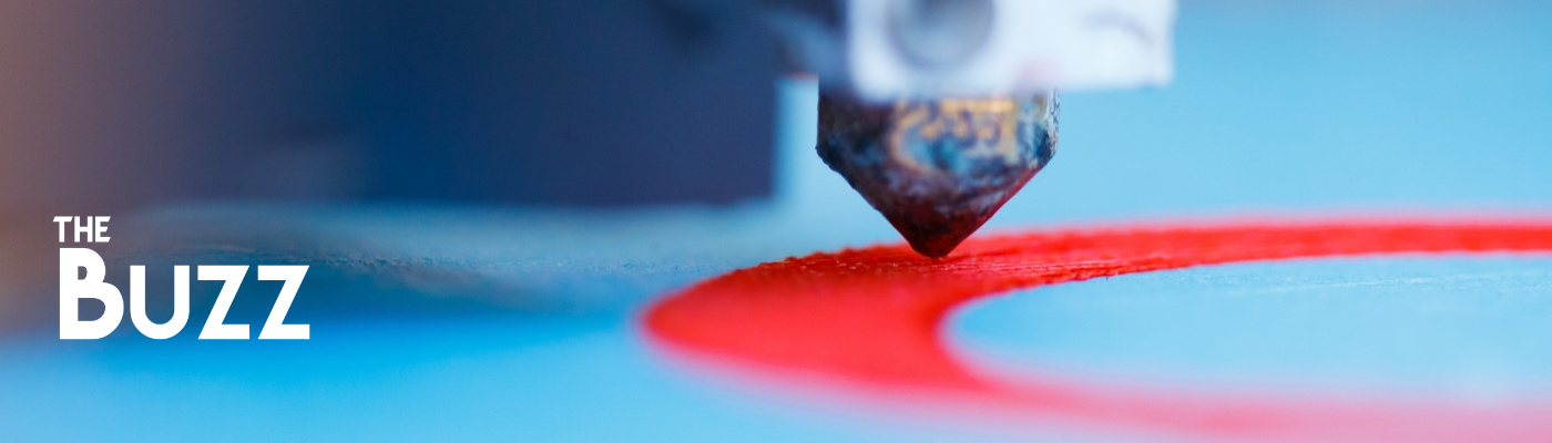 Close up of a 3D printer in action, with The Buzz logo in the corner.