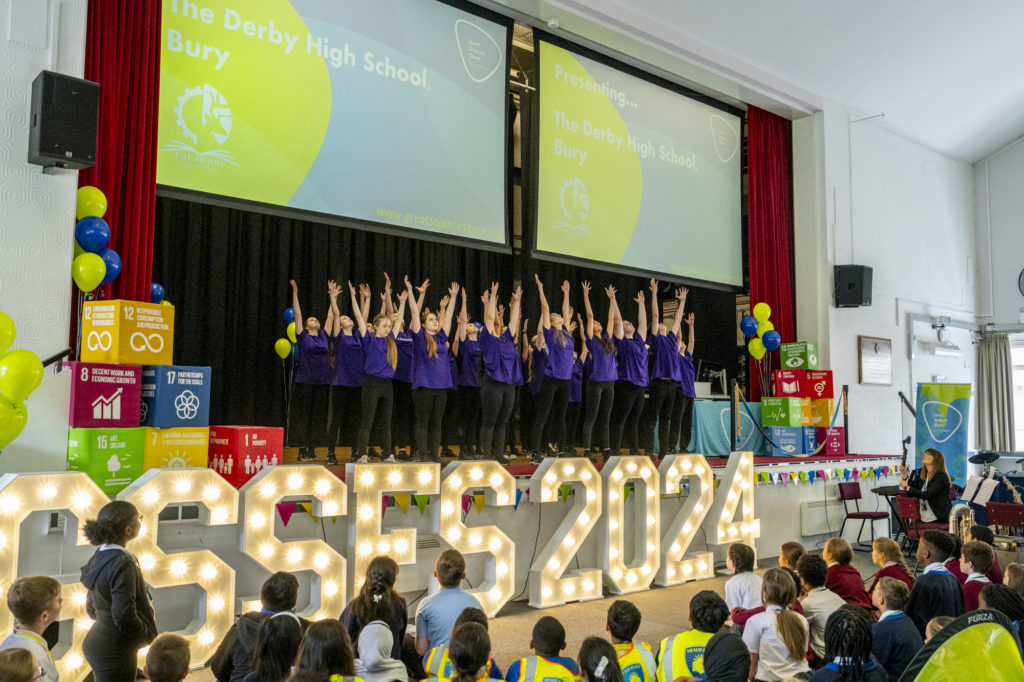 The Great Science Share begins with children on stage, dancing.