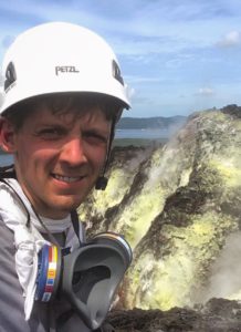 Brendan up a mountain with a hard hat