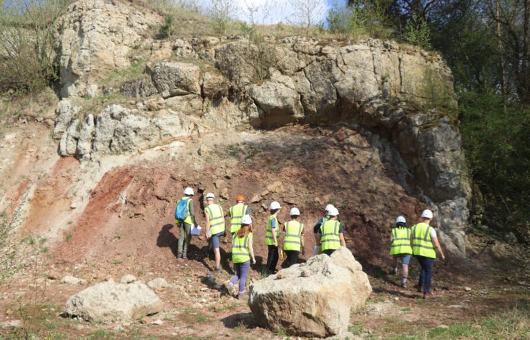 Students in field gear in a crater