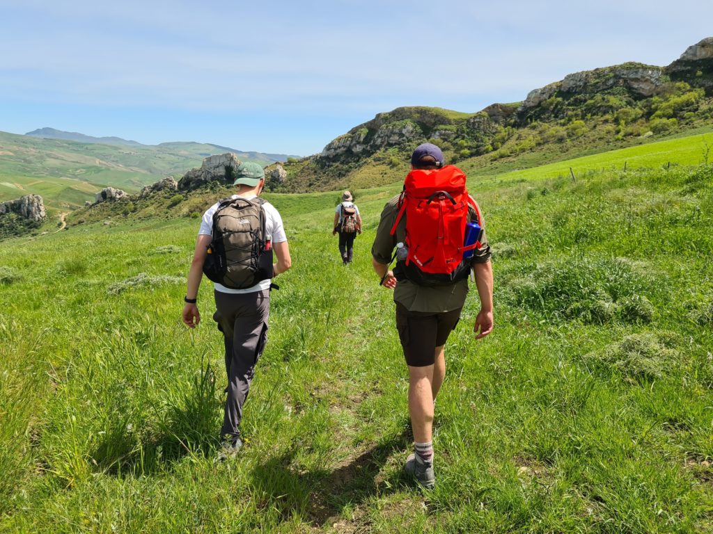 Students walking across a field whilst on a Geology trip to Sicily