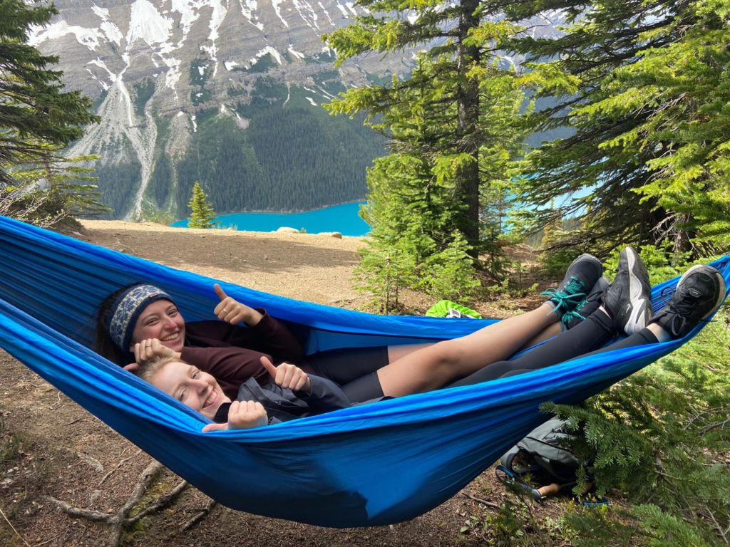 Ezri in a hammock in the rockies with project partner Eleanor.