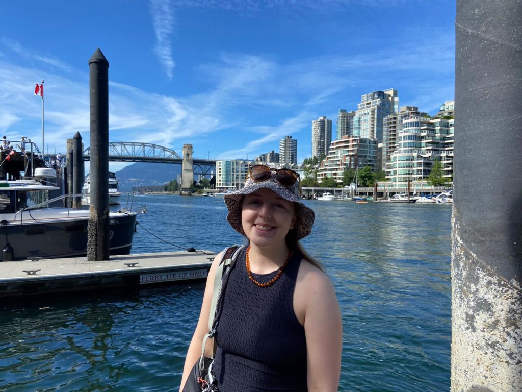 Ezri in front of bridge in Vancouver away from project