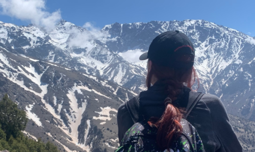 Ayesha looking out at mountain landscape