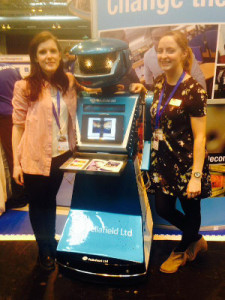 Rhys with a robot (and a colleague) while doing some outreach work