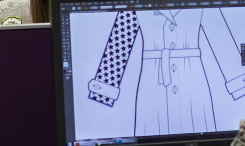 Student working on fashion designs on screen