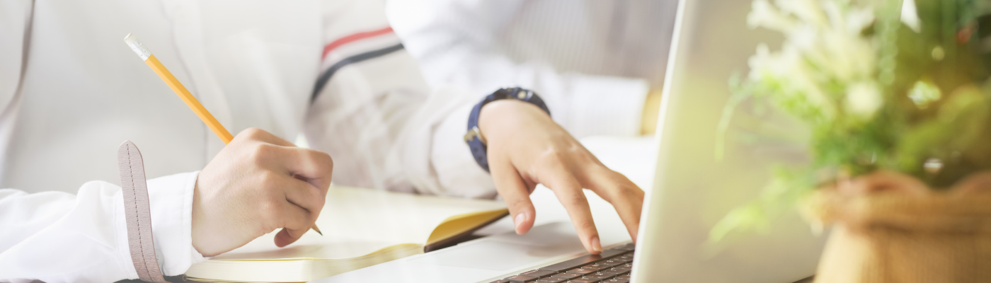 Student with laptop and book