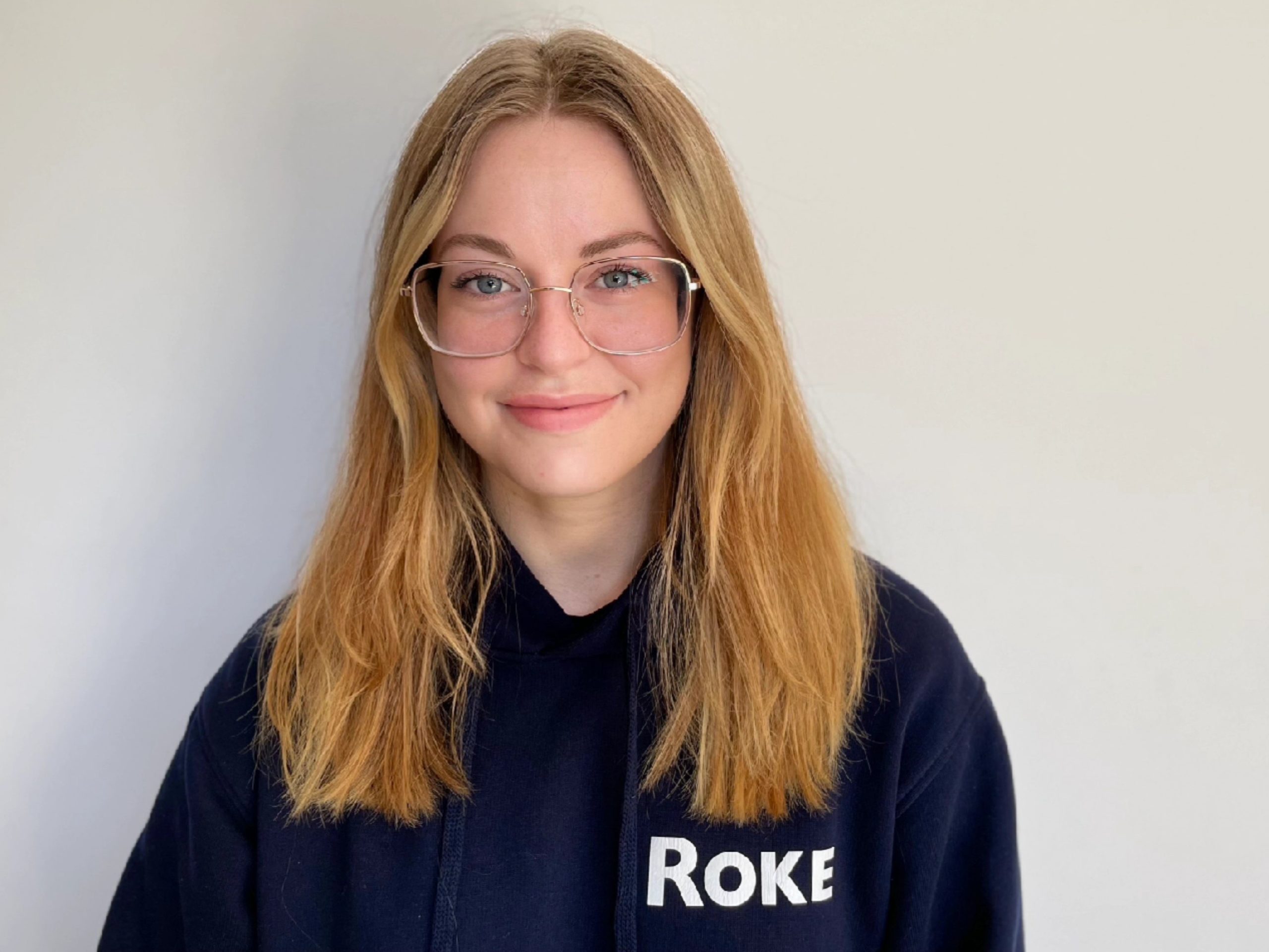 Photograph of Colette in her Roke work hoodie