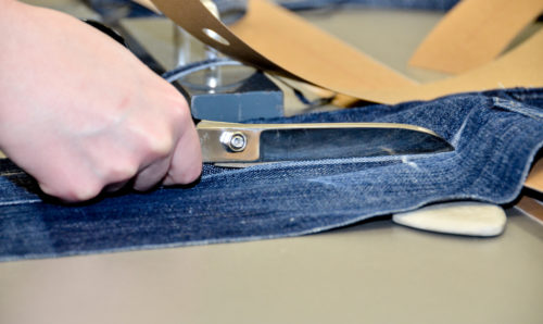 Scissors cutting denim